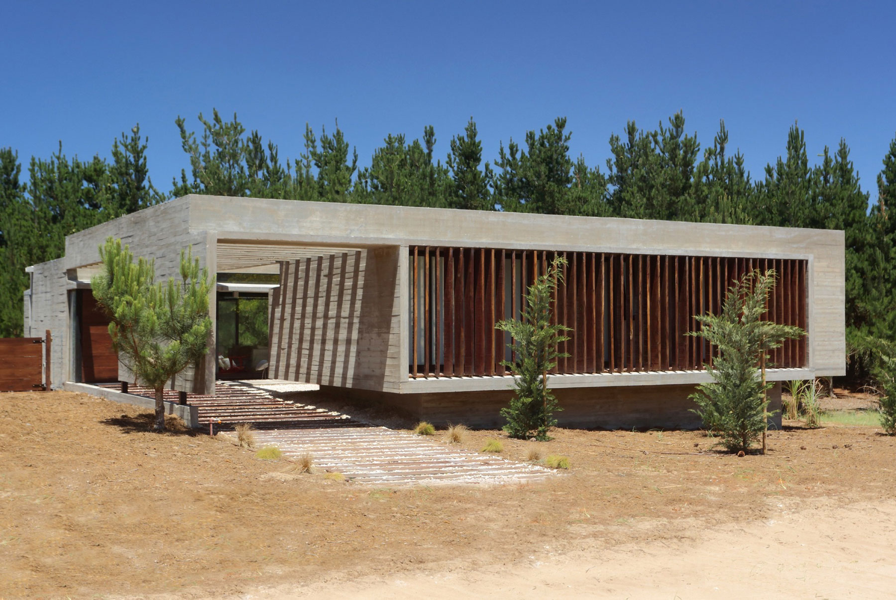 A Stunning Summer House with Concrete Pergola in the Woodland of Pinamar, Argentina by Besonias Almeida Arquitectos (1)