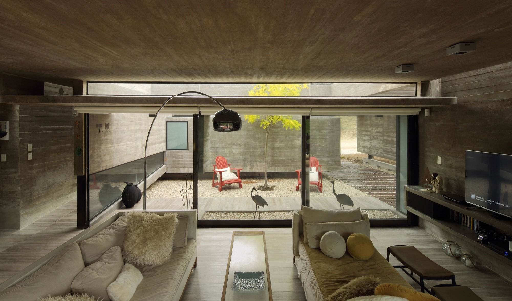 A Stunning Summer House with Concrete Pergola in the Woodland of Pinamar, Argentina by Besonias Almeida Arquitectos (10)