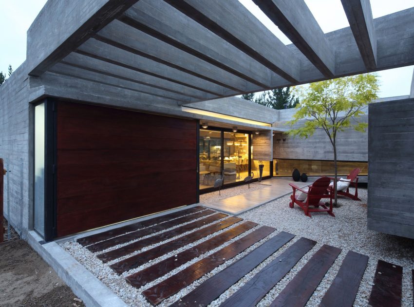 A Stunning Summer House with Concrete Pergola in the Woodland of Pinamar, Argentina by Besonias Almeida Arquitectos (13)