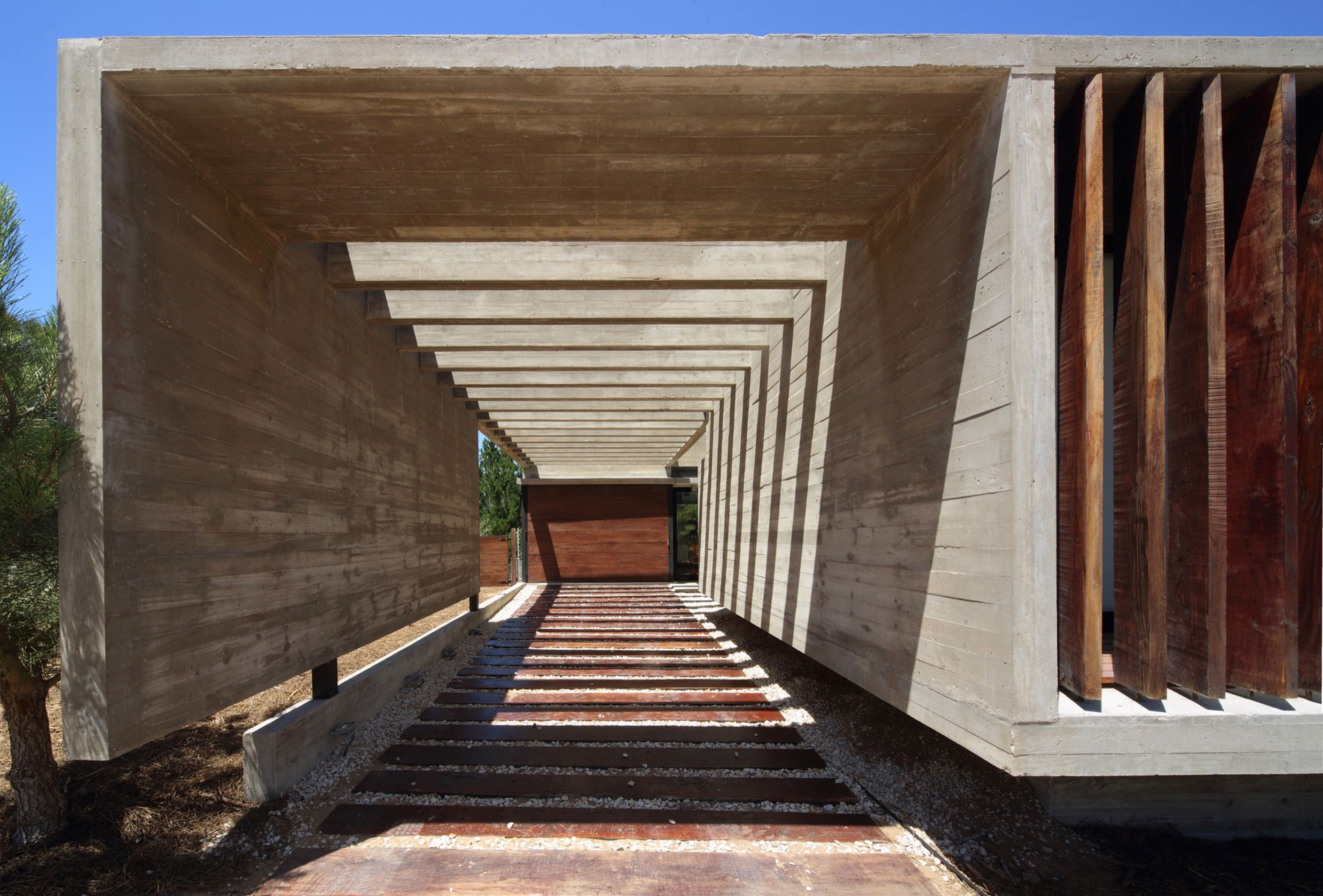 A Stunning Summer House with Concrete Pergola in the Woodland of Pinamar, Argentina by Besonias Almeida Arquitectos (3)