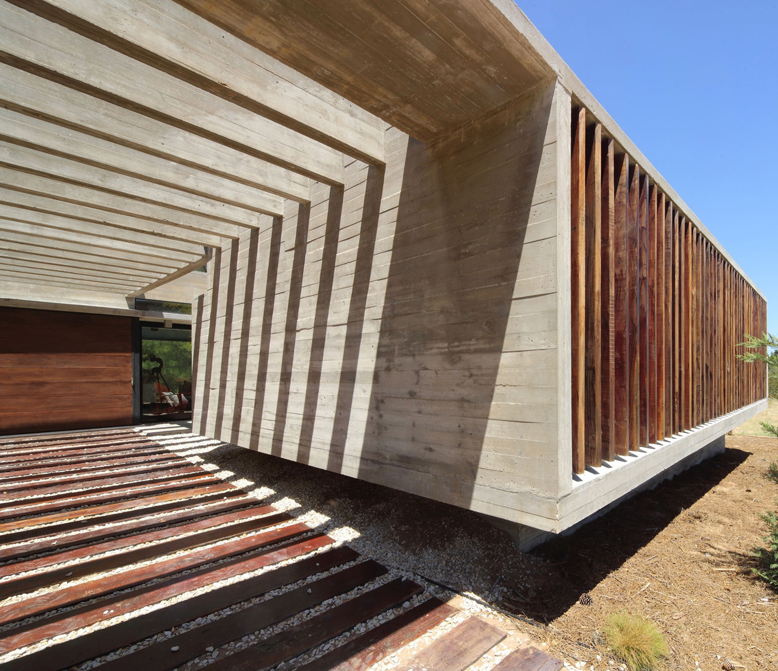A Stunning Summer House with Concrete Pergola in the Woodland of Pinamar, Argentina by Besonias Almeida Arquitectos (5)