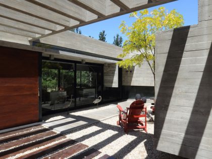 A Stunning Summer House with Concrete Pergola in the Woodland of Pinamar, Argentina by Besonias Almeida Arquitectos (6)