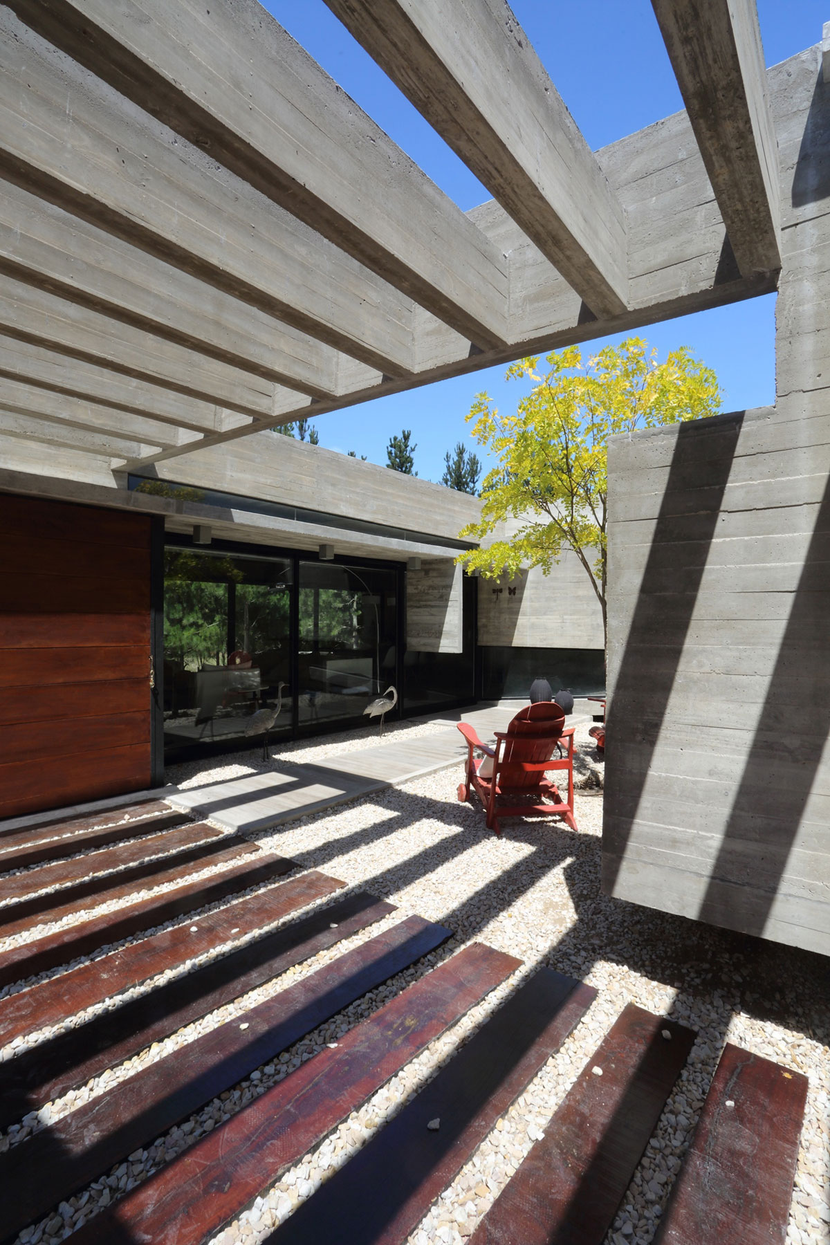 A Stunning Summer House with Concrete Pergola in the Woodland of Pinamar, Argentina by Besonias Almeida Arquitectos (6)