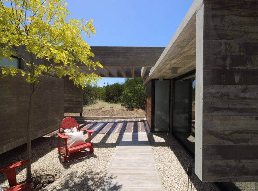 A Stunning Summer House with Concrete Pergola in the Woodland of Pinamar, Argentina by Besonias Almeida Arquitectos (7)