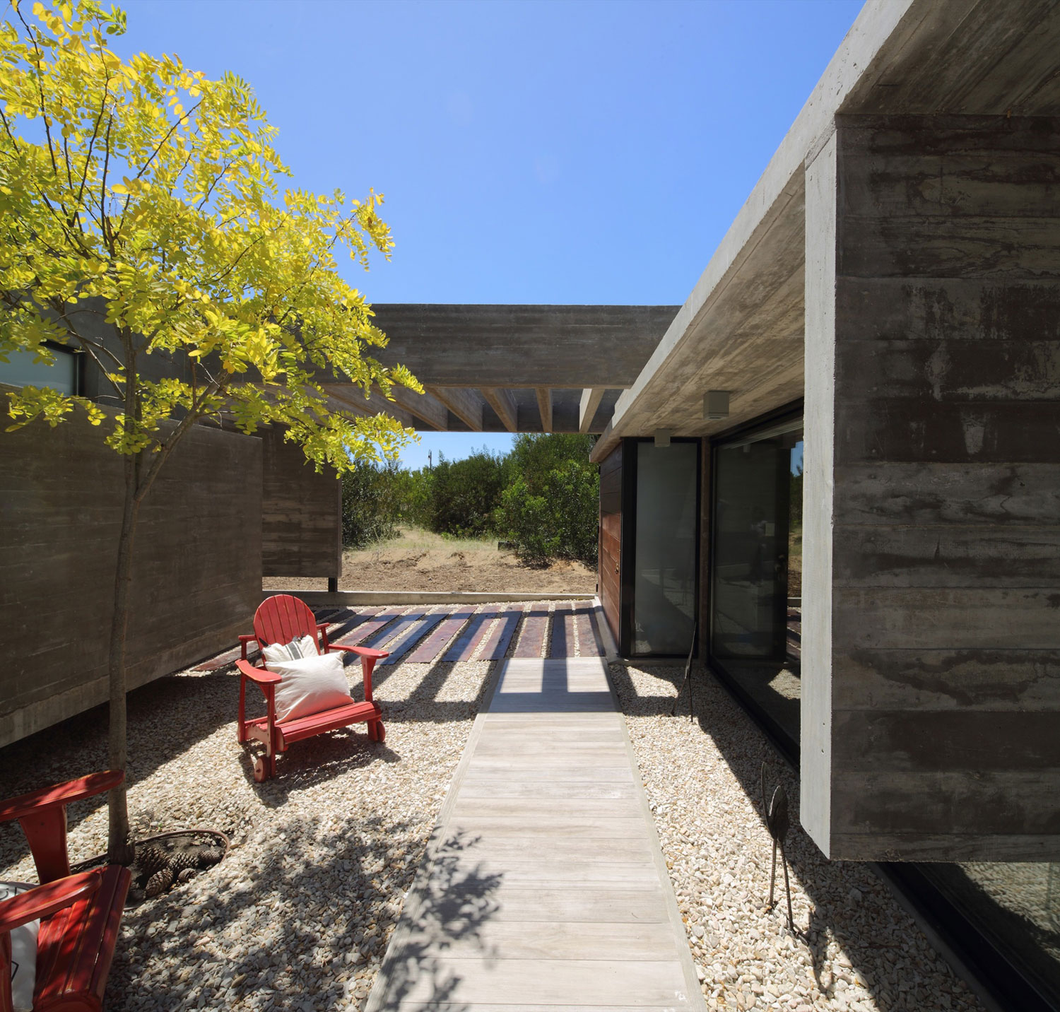 A Stunning Summer House with Concrete Pergola in the Woodland of Pinamar, Argentina by Besonias Almeida Arquitectos (7)