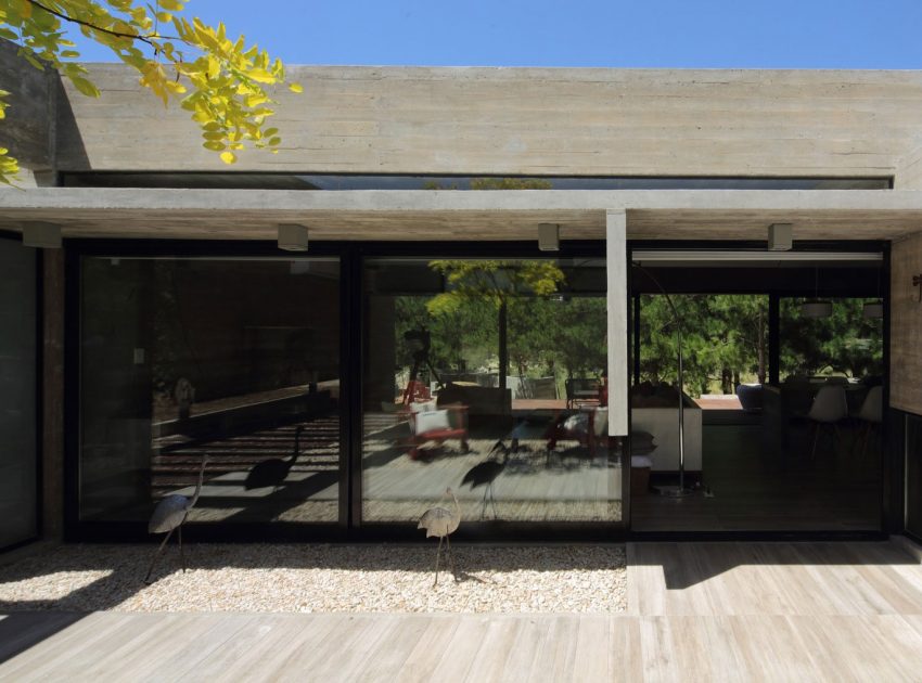 A Stunning Summer House with Concrete Pergola in the Woodland of Pinamar, Argentina by Besonias Almeida Arquitectos (8)