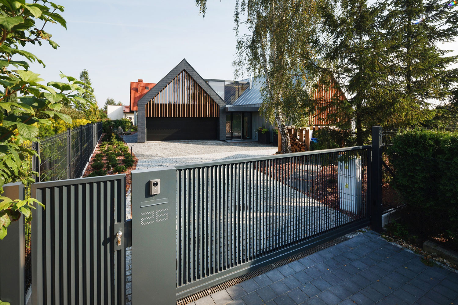 A Stunning and Spacious Two Barns House for a Modern Family in Tychy, Poland by RS + Robert Skitek (1)