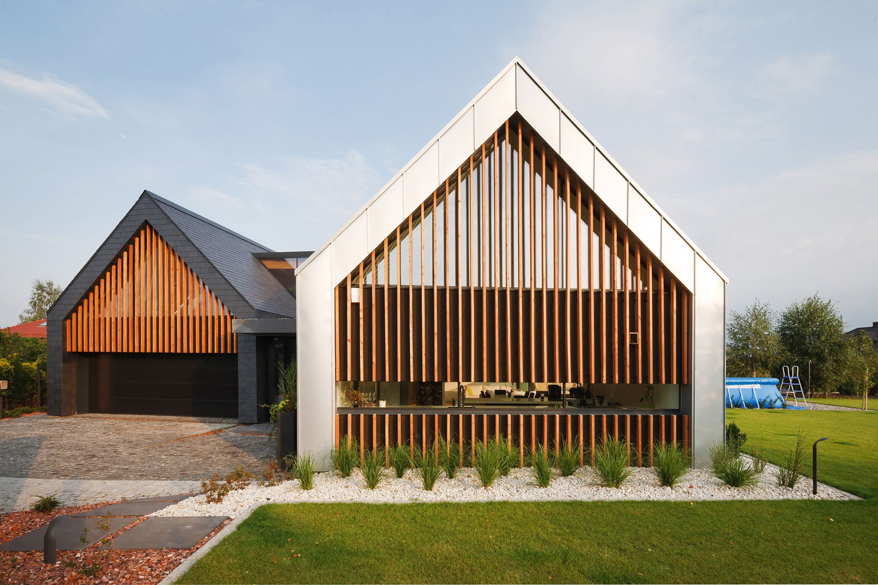 A Stunning and Spacious Two Barns House for a Modern Family in Tychy, Poland by RS + Robert Skitek (3)