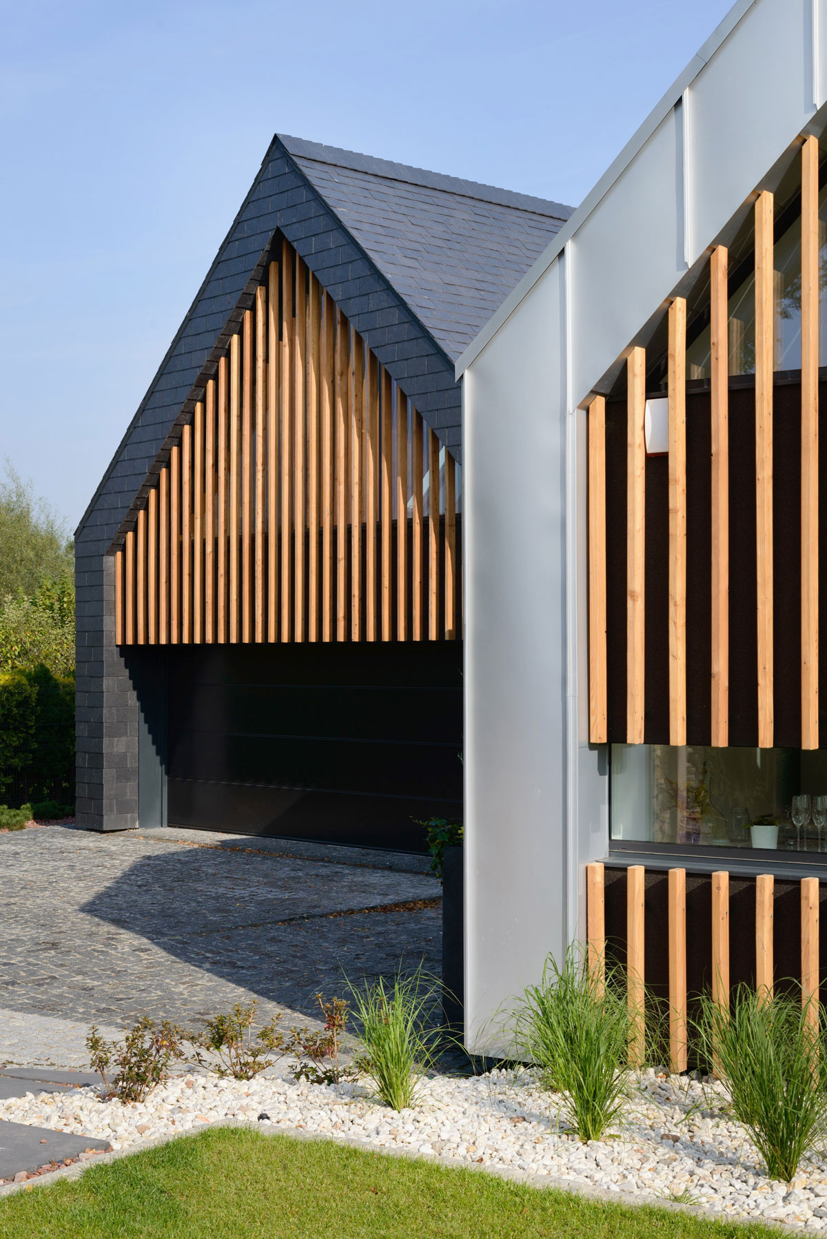 A Stunning and Spacious Two Barns House for a Modern Family in Tychy, Poland by RS + Robert Skitek (4)
