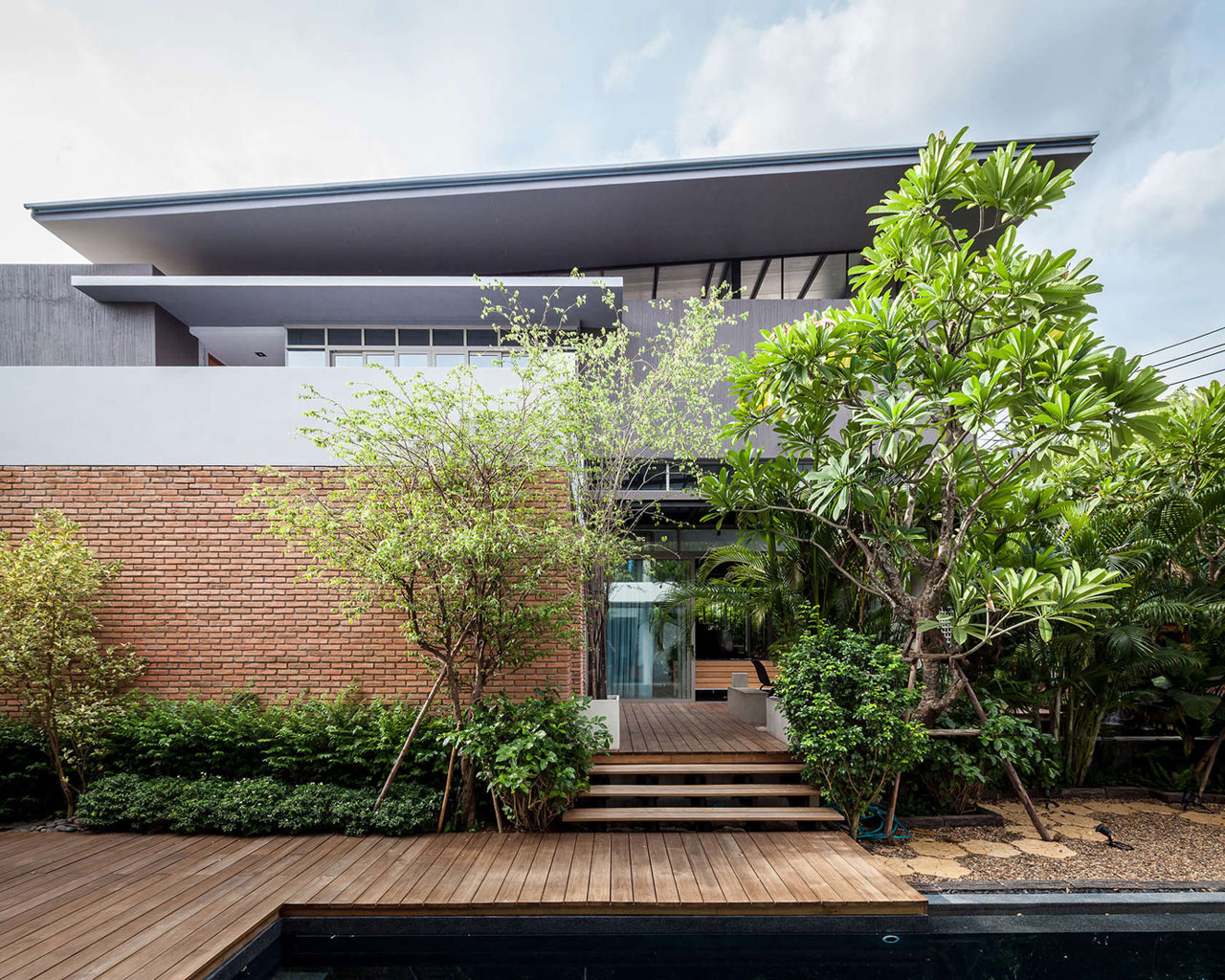 A Striking Modern Industrial House with Sophisticated Accents in Bangkok, Thailand by Alkhemist Architects (1)
