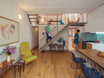 A Colorful and Playful Row Home Separated by Stairs and Mesh Partitions in Barcelona, Spain