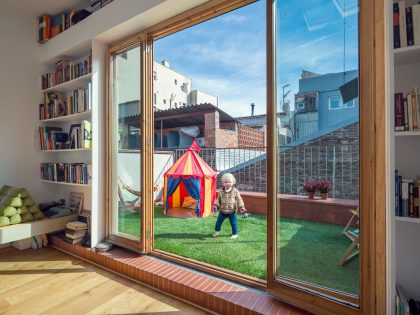 A Colorful and Playful Row Home Separated by Stairs and Mesh Partitions in Barcelona, Spain by Nook Architects (10)