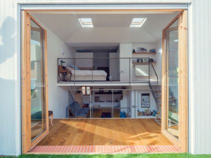 A Colorful and Playful Row Home Separated by Stairs and Mesh Partitions in Barcelona, Spain by Nook Architects (11)