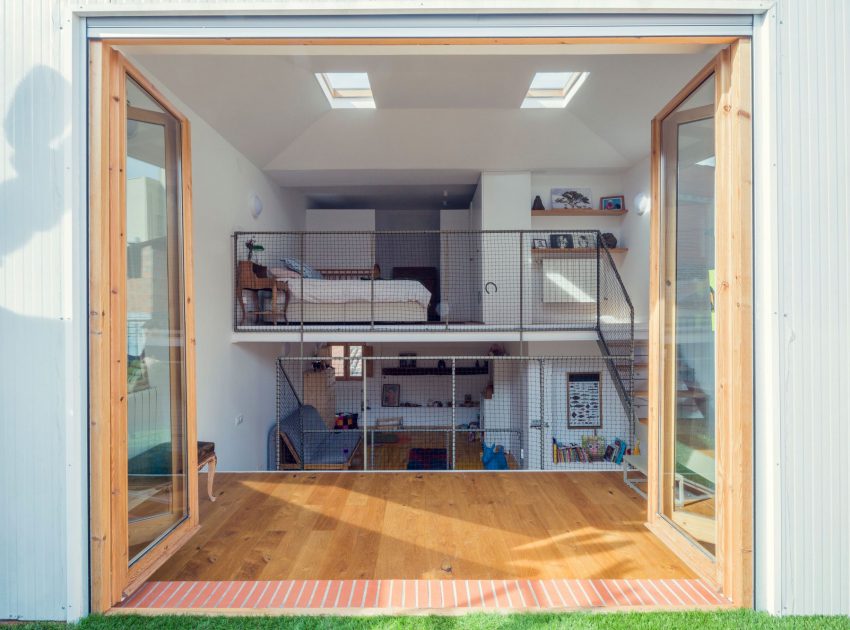 A Colorful and Playful Row Home Separated by Stairs and Mesh Partitions in Barcelona, Spain by Nook Architects (11)