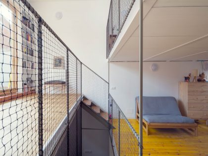 A Colorful and Playful Row Home Separated by Stairs and Mesh Partitions in Barcelona, Spain by Nook Architects (12)