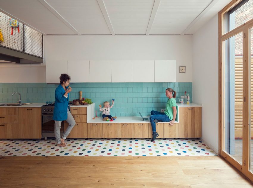 A Colorful and Playful Row Home Separated by Stairs and Mesh Partitions in Barcelona, Spain by Nook Architects (2)