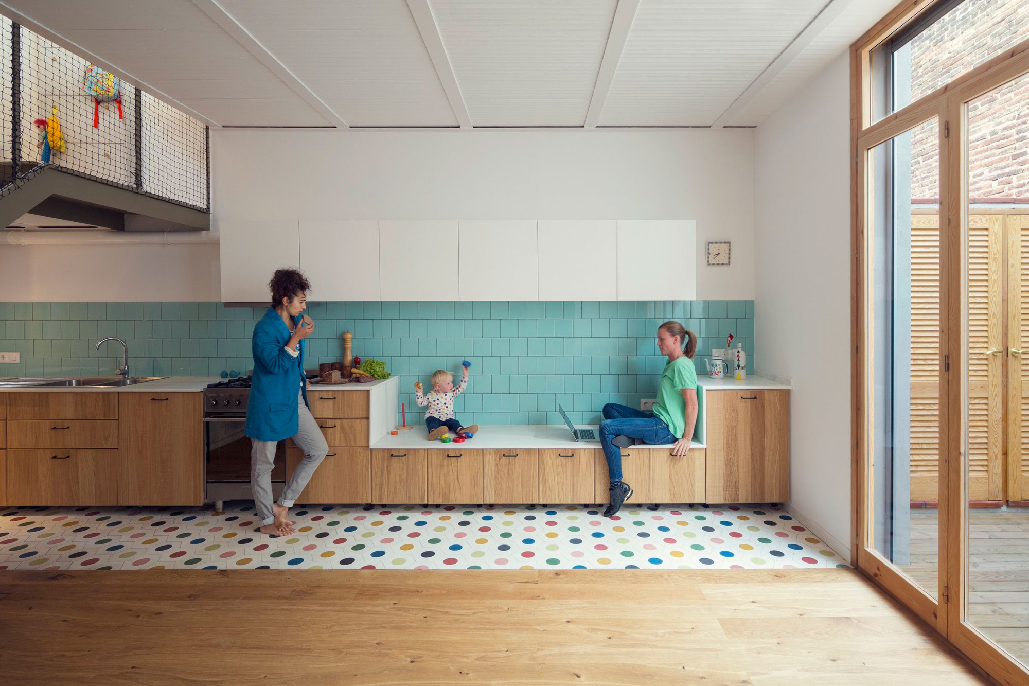 A Colorful and Playful Row Home Separated by Stairs and Mesh Partitions in Barcelona, Spain by Nook Architects (2)
