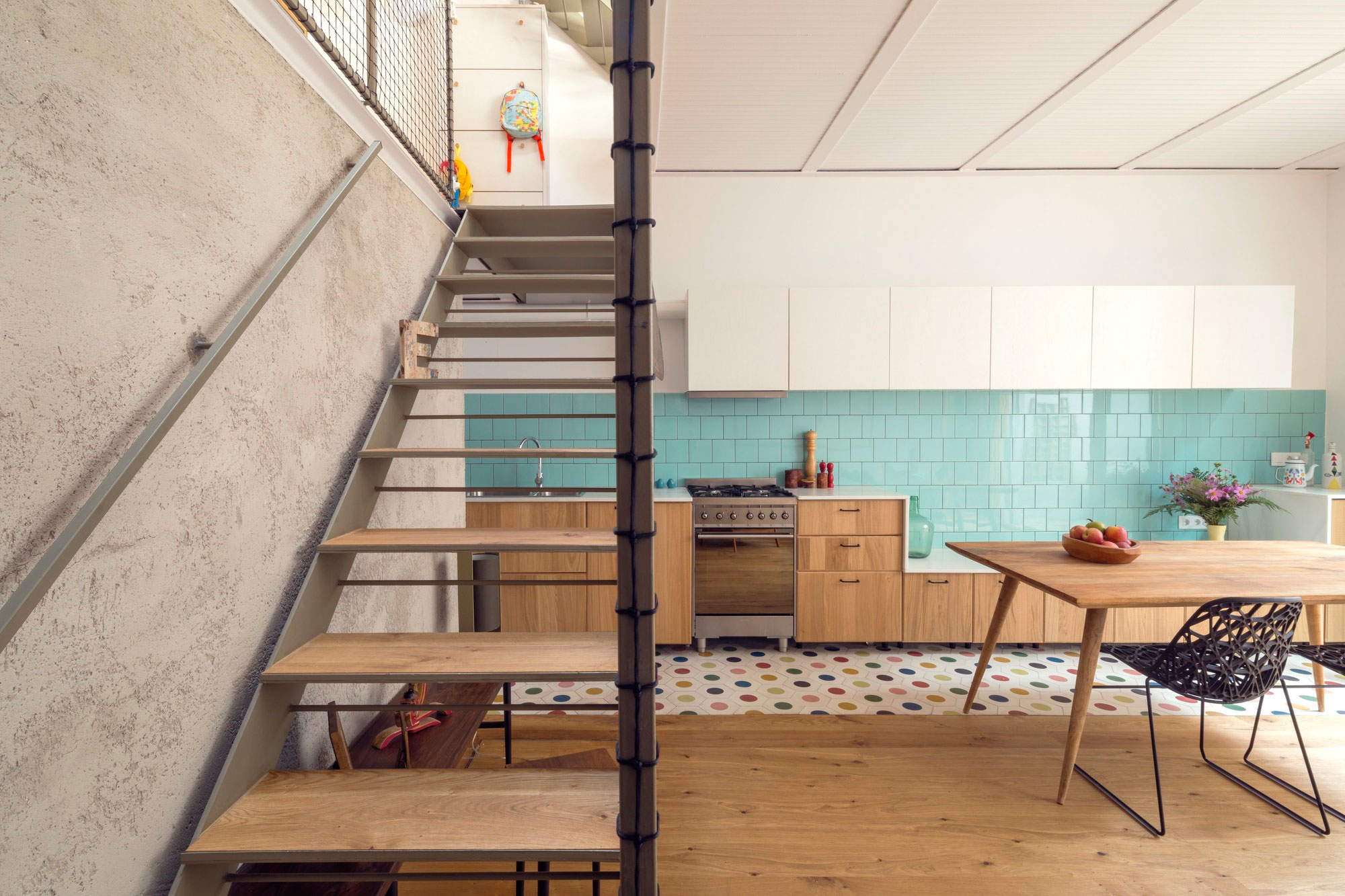 A Colorful and Playful Row Home Separated by Stairs and Mesh Partitions in Barcelona, Spain by Nook Architects (4)