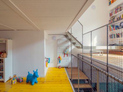 A Colorful and Playful Row Home Separated by Stairs and Mesh Partitions in Barcelona, Spain by Nook Architects (6)