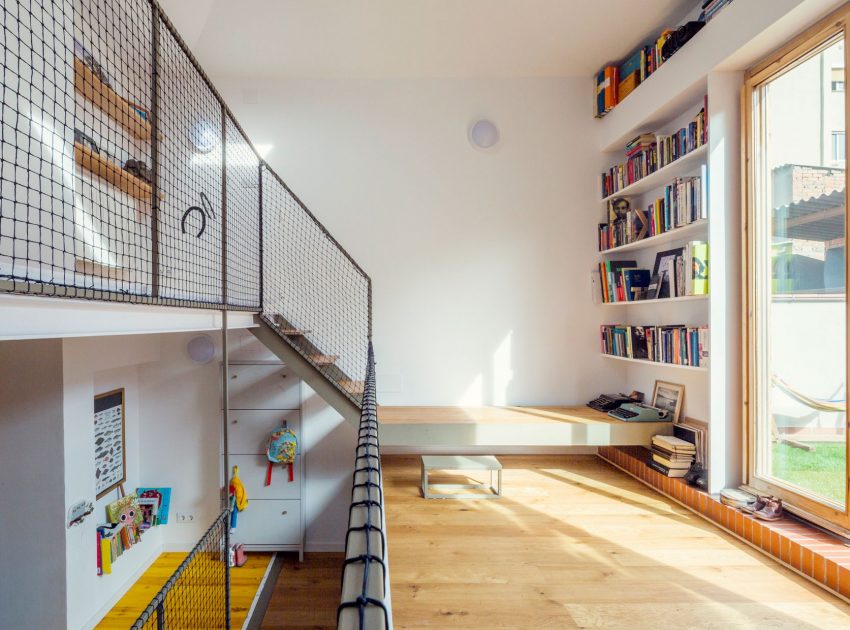 A Colorful and Playful Row Home Separated by Stairs and Mesh Partitions in Barcelona, Spain by Nook Architects (7)