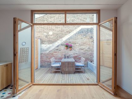 A Colorful and Playful Row Home Separated by Stairs and Mesh Partitions in Barcelona, Spain by Nook Architects (8)