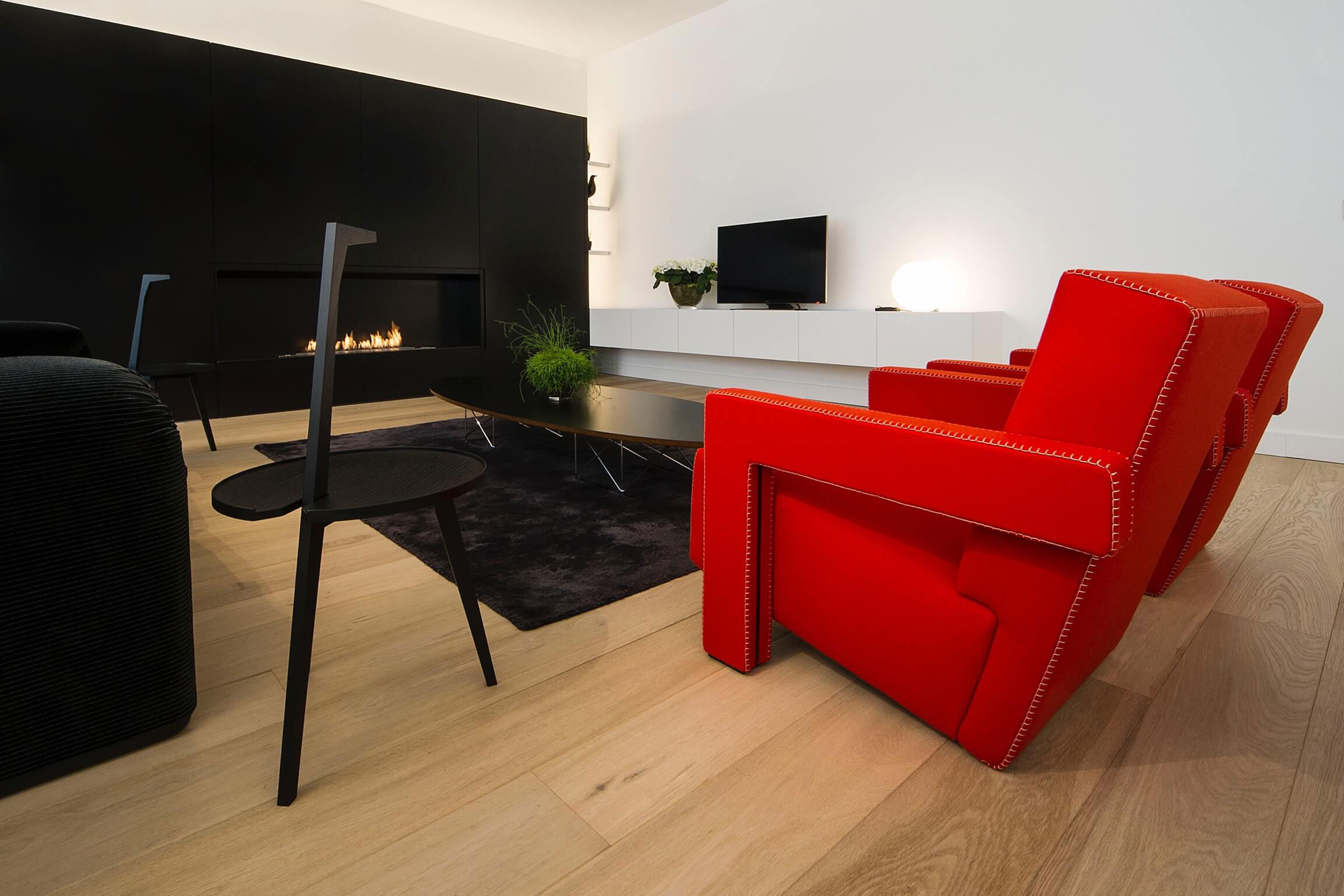A Contemporary Apartment with Shades of Red and Black Furniture in Mortsel, Belgium by Filip Deslee (3)