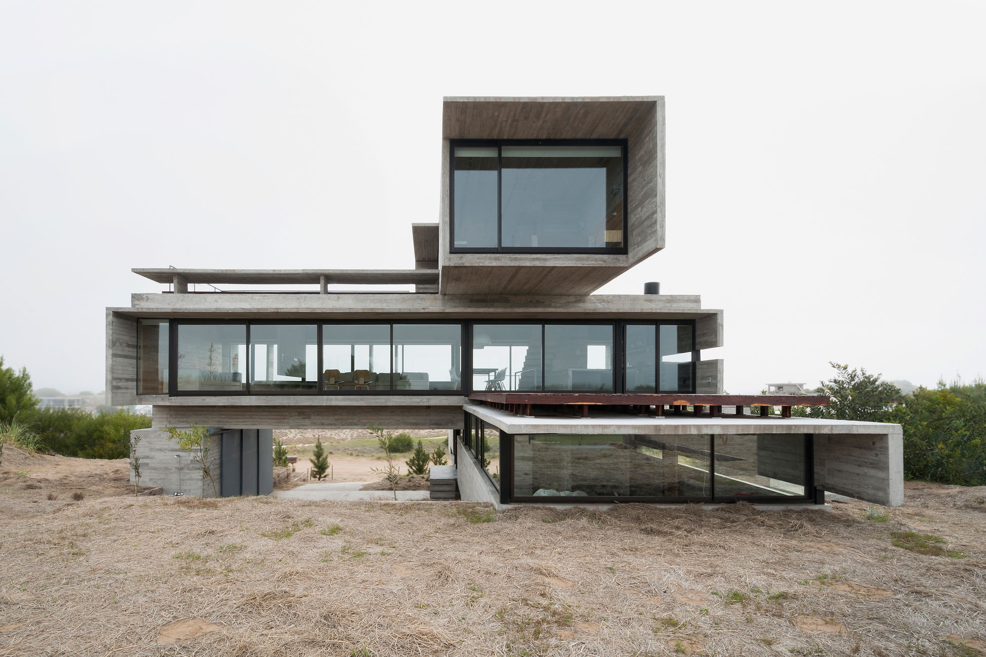 A Contemporary Concrete Home Made of Three Stacked Volumes in La Costa Partido by Luciano Kruk Arquitectos (1)