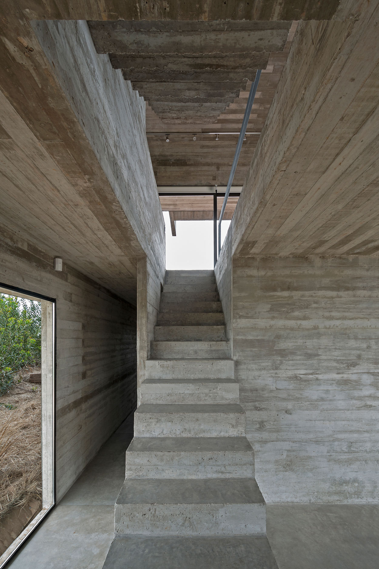 A Contemporary Concrete Home Made of Three Stacked Volumes in La Costa Partido by Luciano Kruk Arquitectos (10)