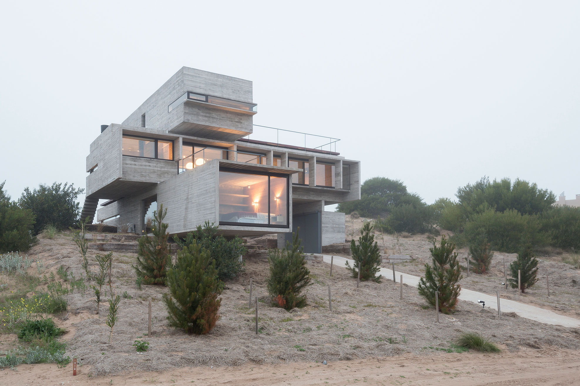 A Contemporary Concrete Home Made of Three Stacked Volumes in La Costa Partido by Luciano Kruk Arquitectos (14)
