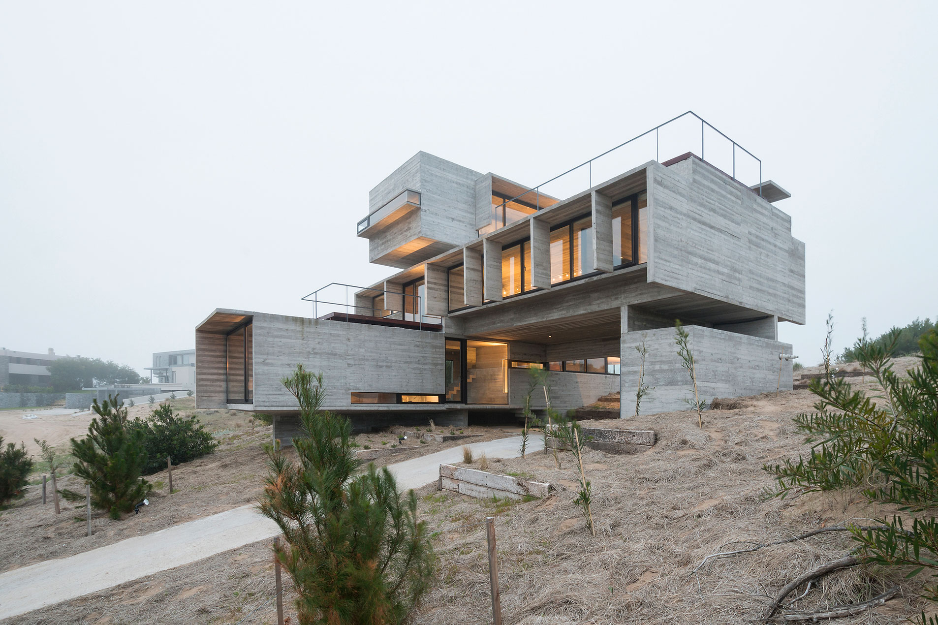 A Contemporary Concrete Home Made of Three Stacked Volumes in La Costa Partido by Luciano Kruk Arquitectos (15)