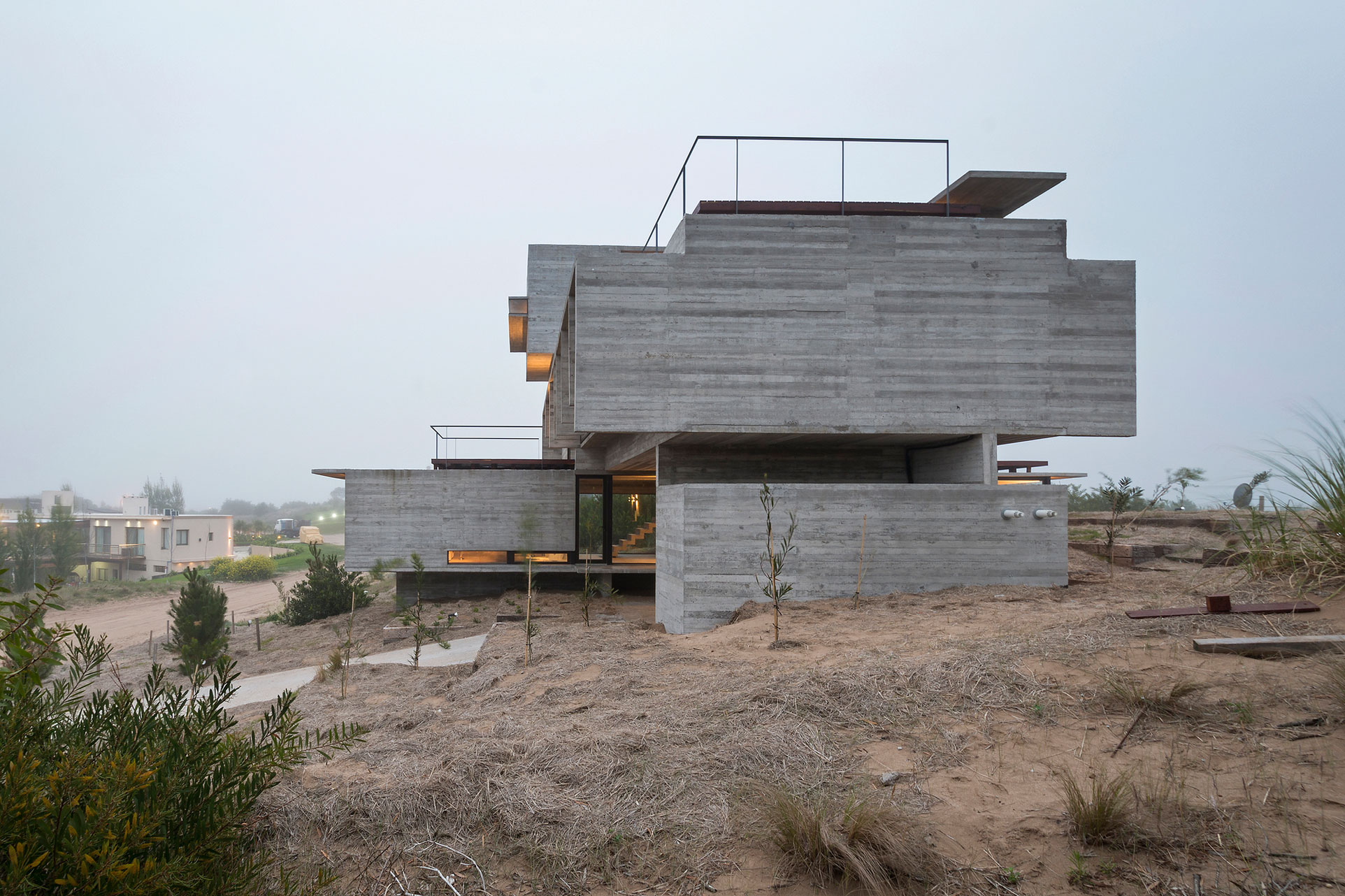 A Contemporary Concrete Home Made of Three Stacked Volumes in La Costa Partido by Luciano Kruk Arquitectos (16)
