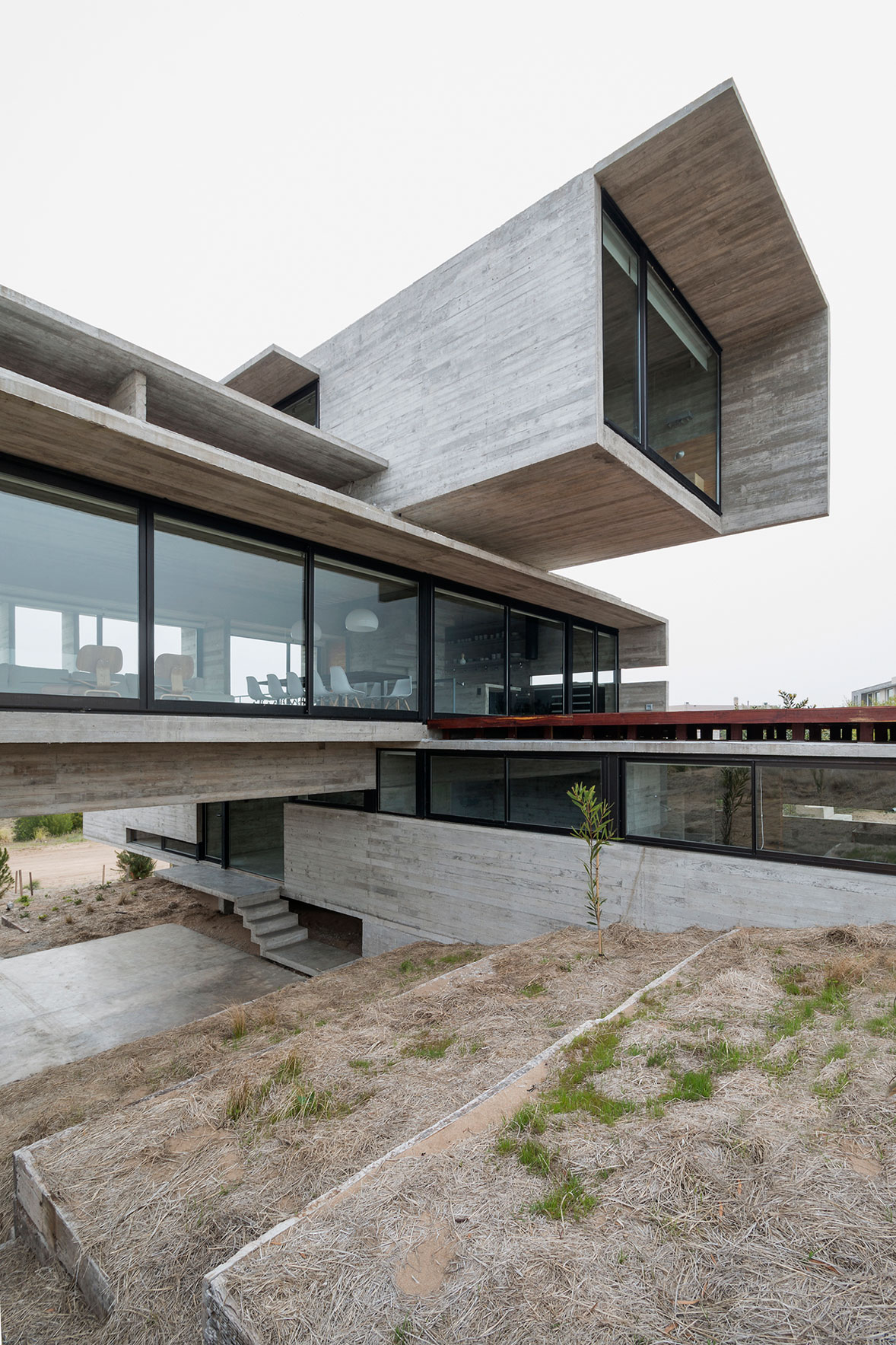 A Contemporary Concrete Home Made of Three Stacked Volumes in La Costa Partido by Luciano Kruk Arquitectos (2)