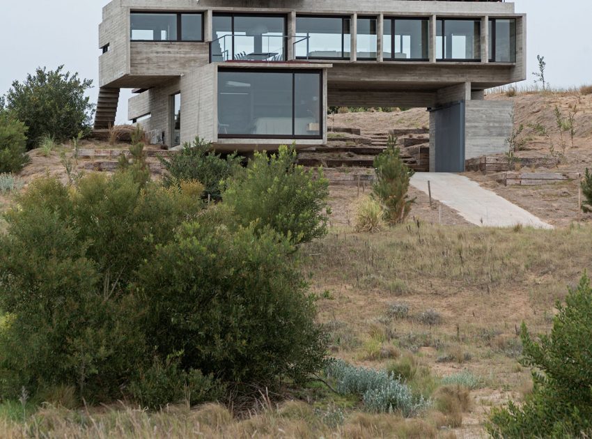 A Contemporary Concrete Home Made of Three Stacked Volumes in La Costa Partido by Luciano Kruk Arquitectos (3)