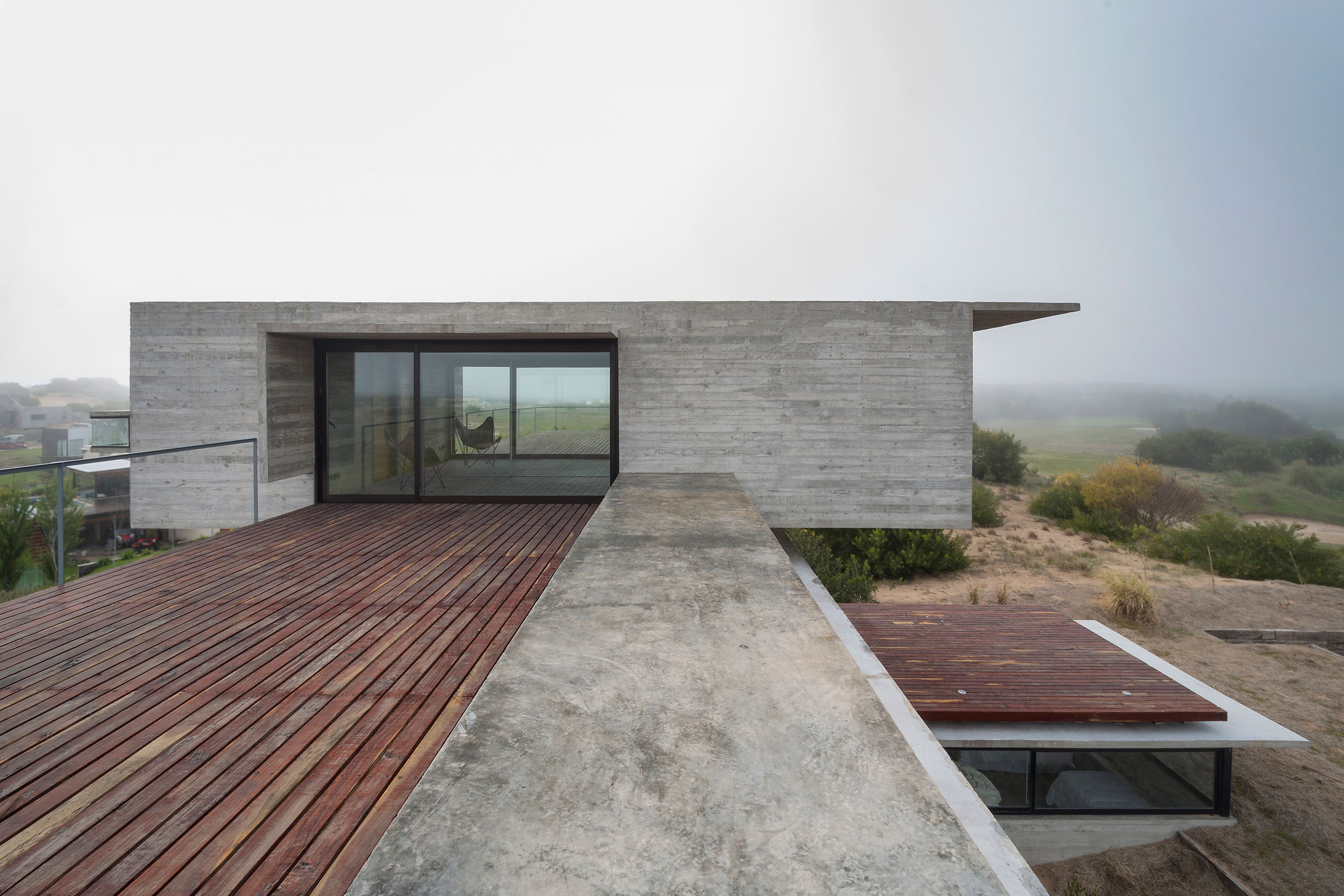 A Contemporary Concrete Home Made of Three Stacked Volumes in La Costa Partido by Luciano Kruk Arquitectos (4)