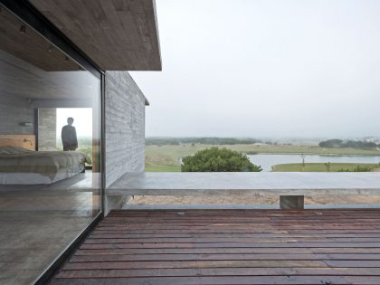 A Contemporary Concrete Home Made of Three Stacked Volumes in La Costa Partido by Luciano Kruk Arquitectos (6)