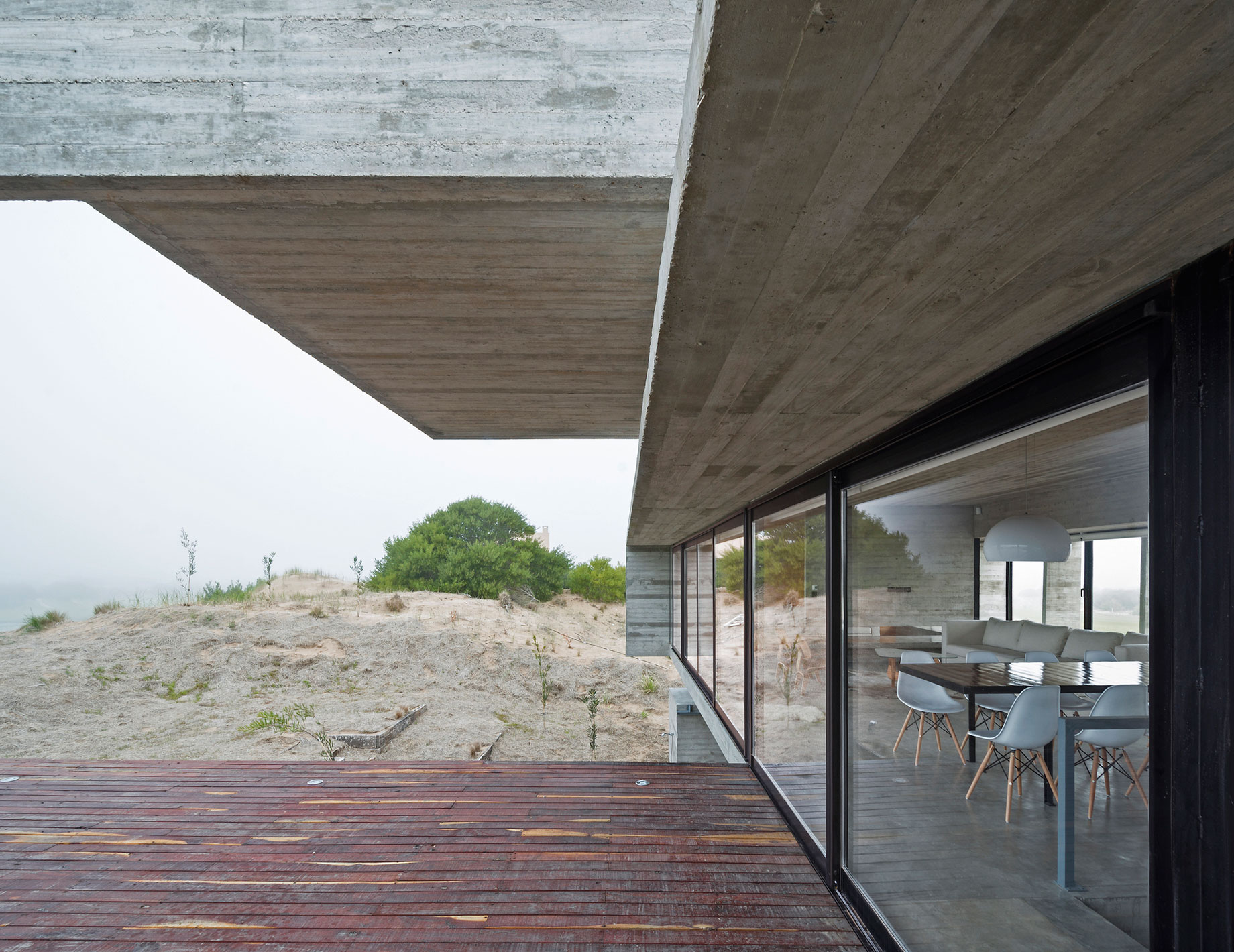 A Contemporary Concrete Home Made of Three Stacked Volumes in La Costa Partido by Luciano Kruk Arquitectos (7)