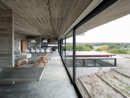 A Contemporary Concrete Home Made of Three Stacked Volumes in La Costa Partido by Luciano Kruk Arquitectos (9)