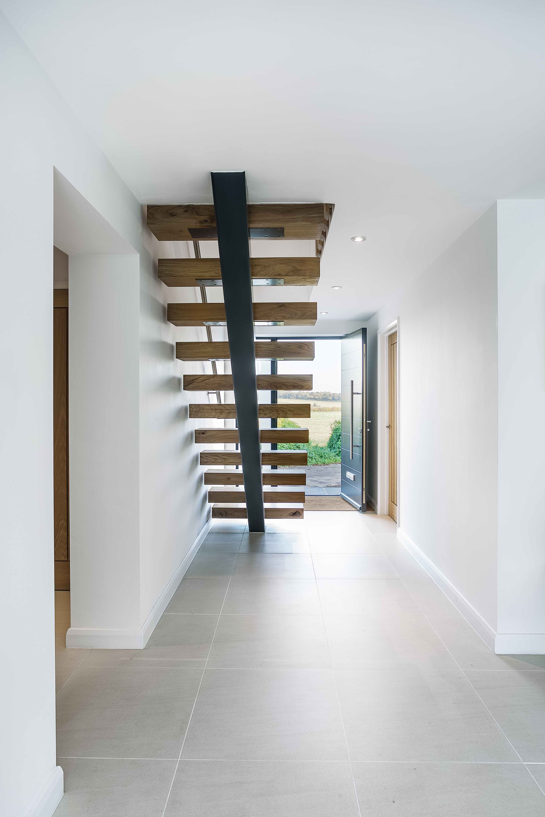 A Contemporary Extensions to a Luminous House with Brick Façade in Crawley by Adam Knibb Architects (7)