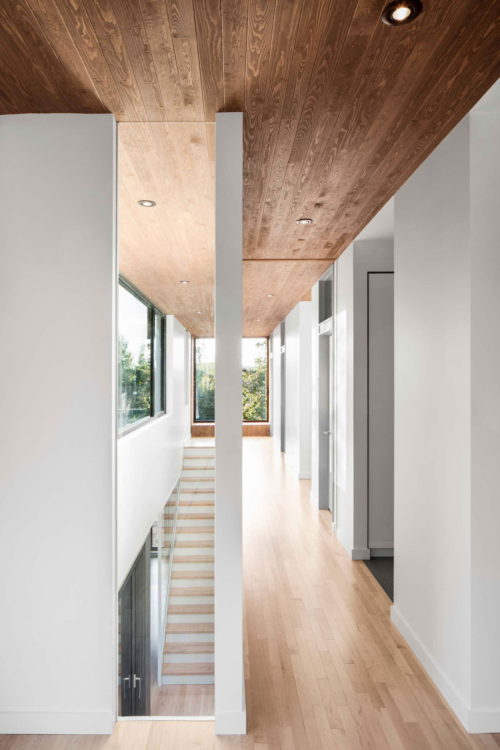 A Contemporary Home Combines Wood and Steel Panelling in Rimouski by NatureHumaine (13)