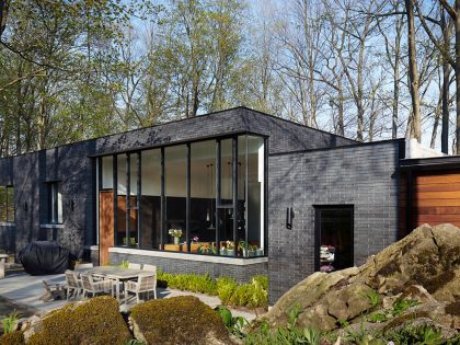 A Stylish Modern Dark Brick Home in the Lush Forests of Dundas, Ontario