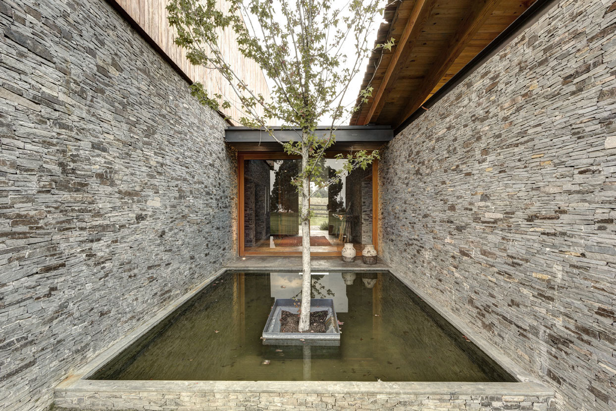 A Contemporary Home with Rustic Elements of Wood and Stone in Mexico by Elías Rizo Arquitectos (7)