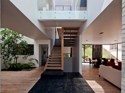 A Contemporary House Made of Wood, Concrete and Volcanic Stone in Mexico City by Materia Arquitectonica (16)