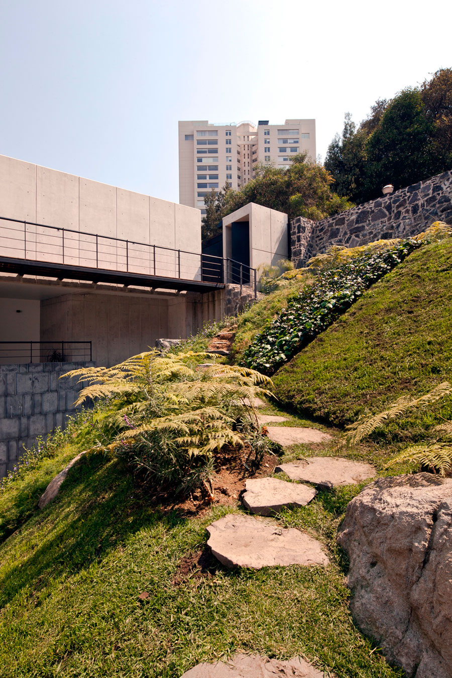 A Contemporary House Made of Wood, Concrete and Volcanic Stone in Mexico City by Materia Arquitectonica (3)