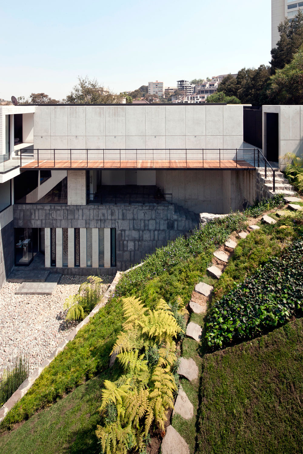 A Contemporary House Made of Wood, Concrete and Volcanic Stone in Mexico City by Materia Arquitectonica (4)