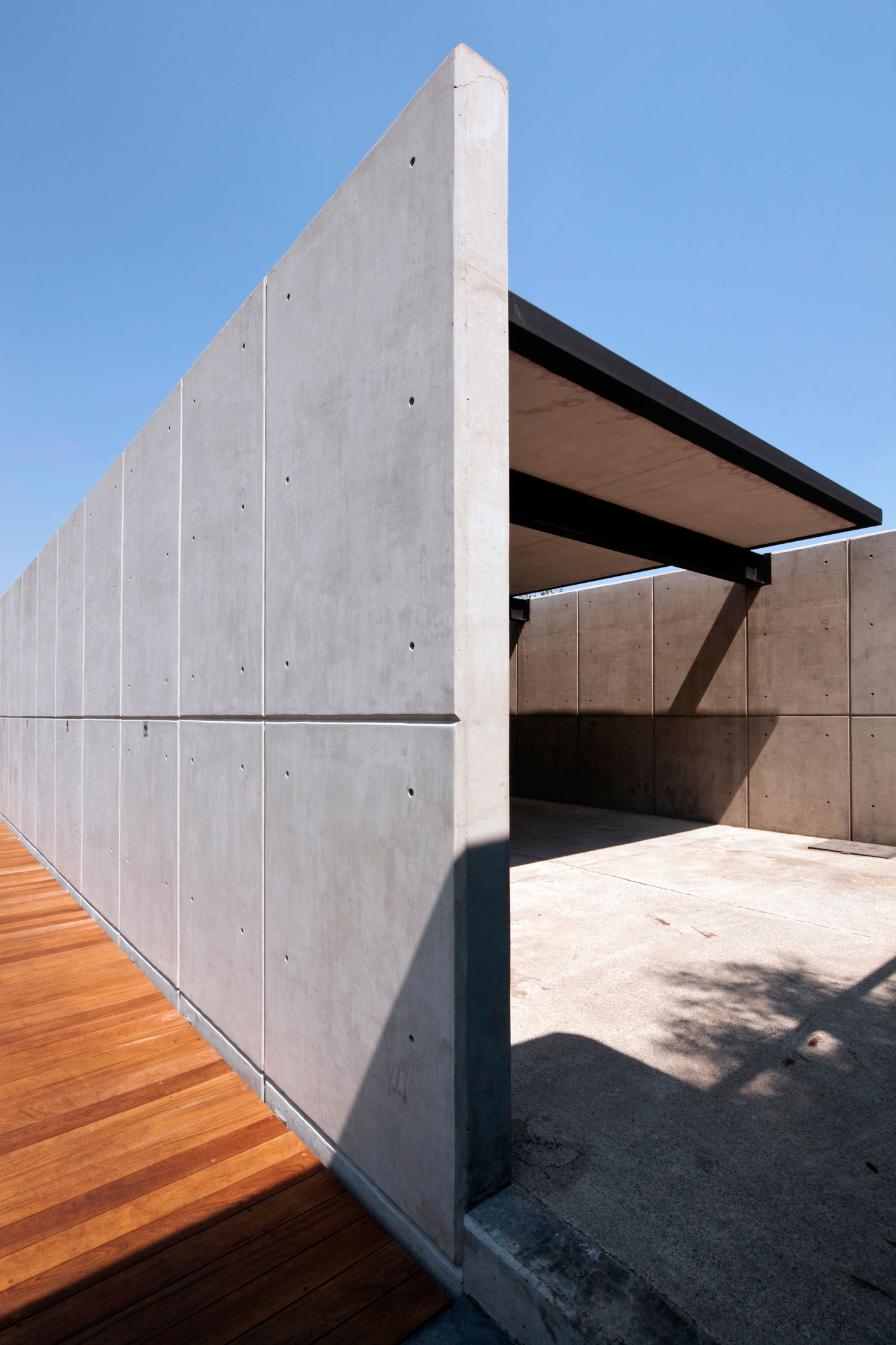 A Contemporary House Made of Wood, Concrete and Volcanic Stone in Mexico City by Materia Arquitectonica (9)