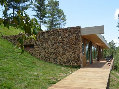 A Contemporary House with Exposed Concrete Walls and Excavated Rock in Dominican Republic