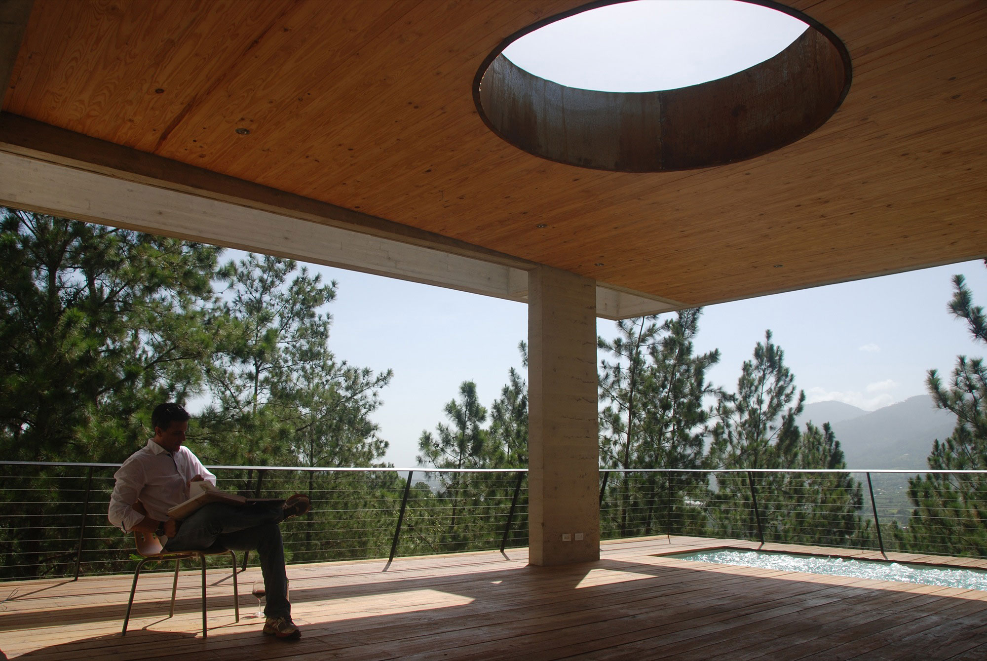 A Contemporary House with Exposed Concrete Walls and Excavated Rock in Dominican Republic by VASHO (16)