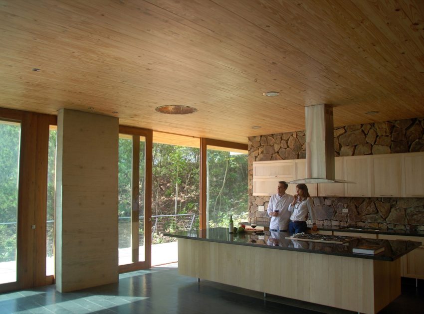 A Contemporary House with Exposed Concrete Walls and Excavated Rock in Dominican Republic by VASHO (19)