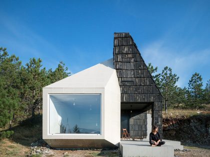 A Contemporary Mountain Home Enclosed by White Ceramic Tiles and Dark Wooden Shingles in Divčibare