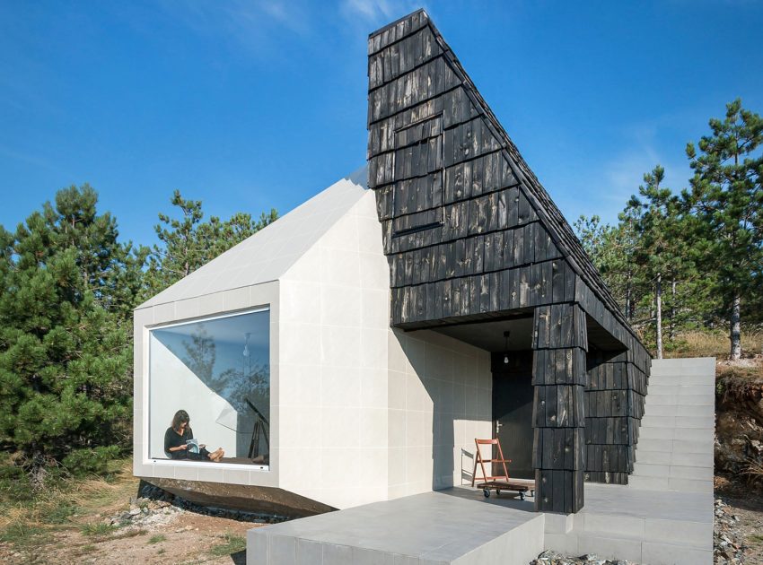 A Contemporary Mountain Home Enclosed by White Ceramic Tiles and Dark Wooden Shingles in Divčibare by EXE studio (2)